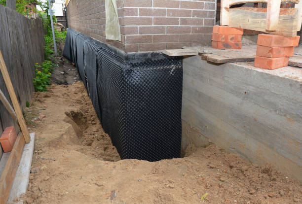 Happy homeowners after waterproofing job in Buckner